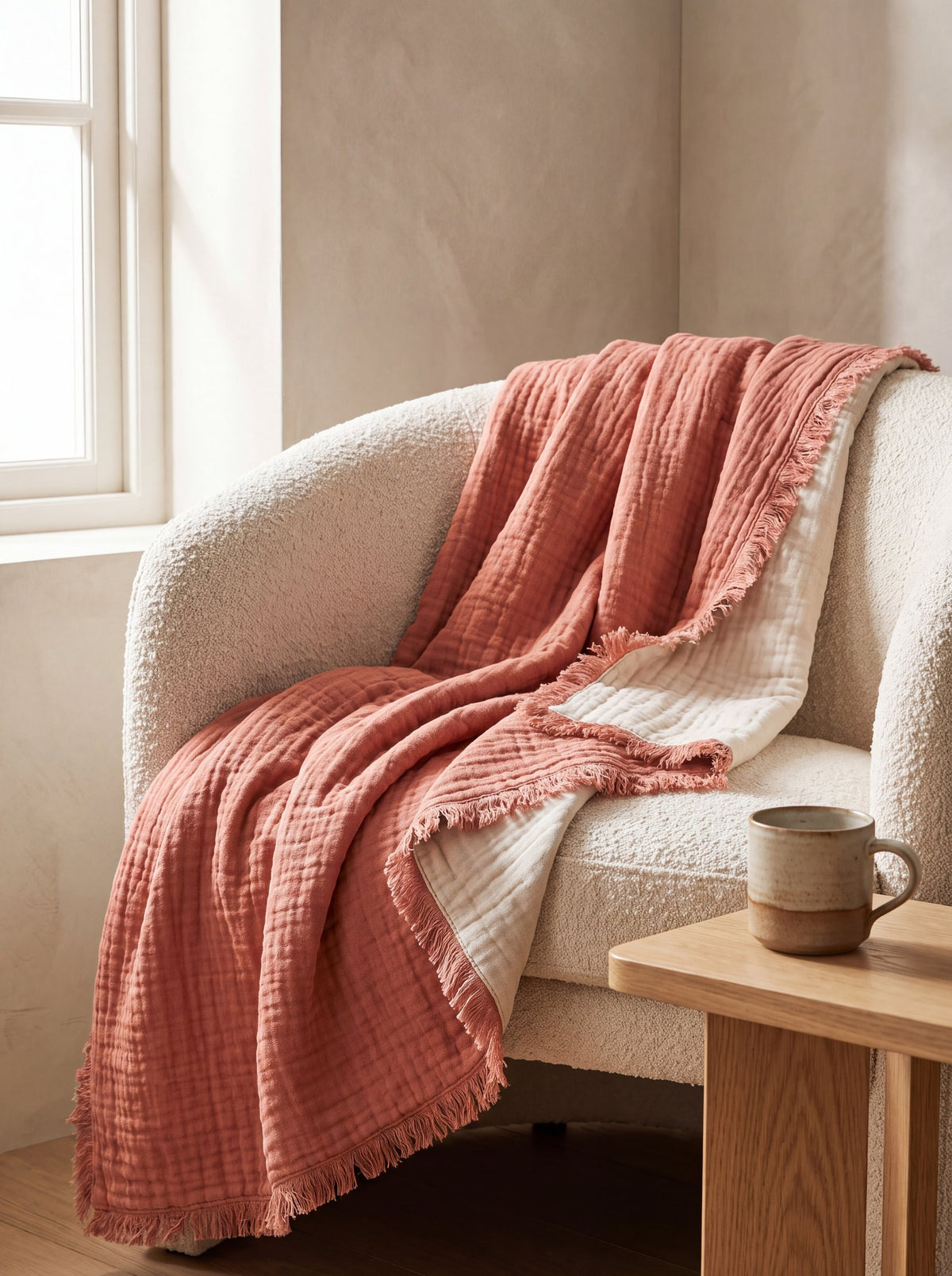 Terracotta muslin throw on a sofa