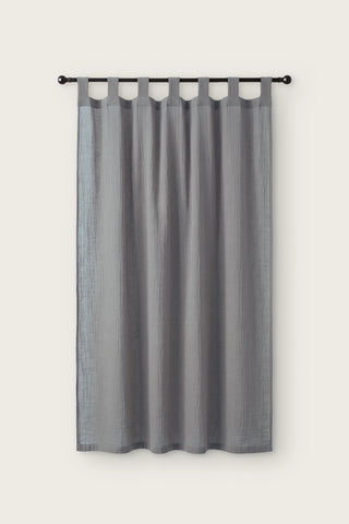 2-layer muslin cotton curtain panel in gray, single tab top panel on a black rod, front view