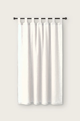 2-layer muslin cotton curtain panel in white, single tab top panel on a black rod, front view