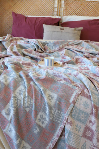 Natural patterned muslin bedspread showing woven Anatolian motifs by Vivamaison