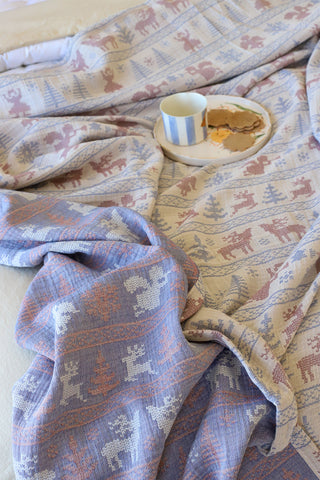 Natural patterned muslin bedspread showing woven Anatolian motifs by Vivamaison