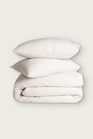 Crinkle muslin Turkish cotton duvet cover set in ecru, folded duvet with two pillowcases, front view