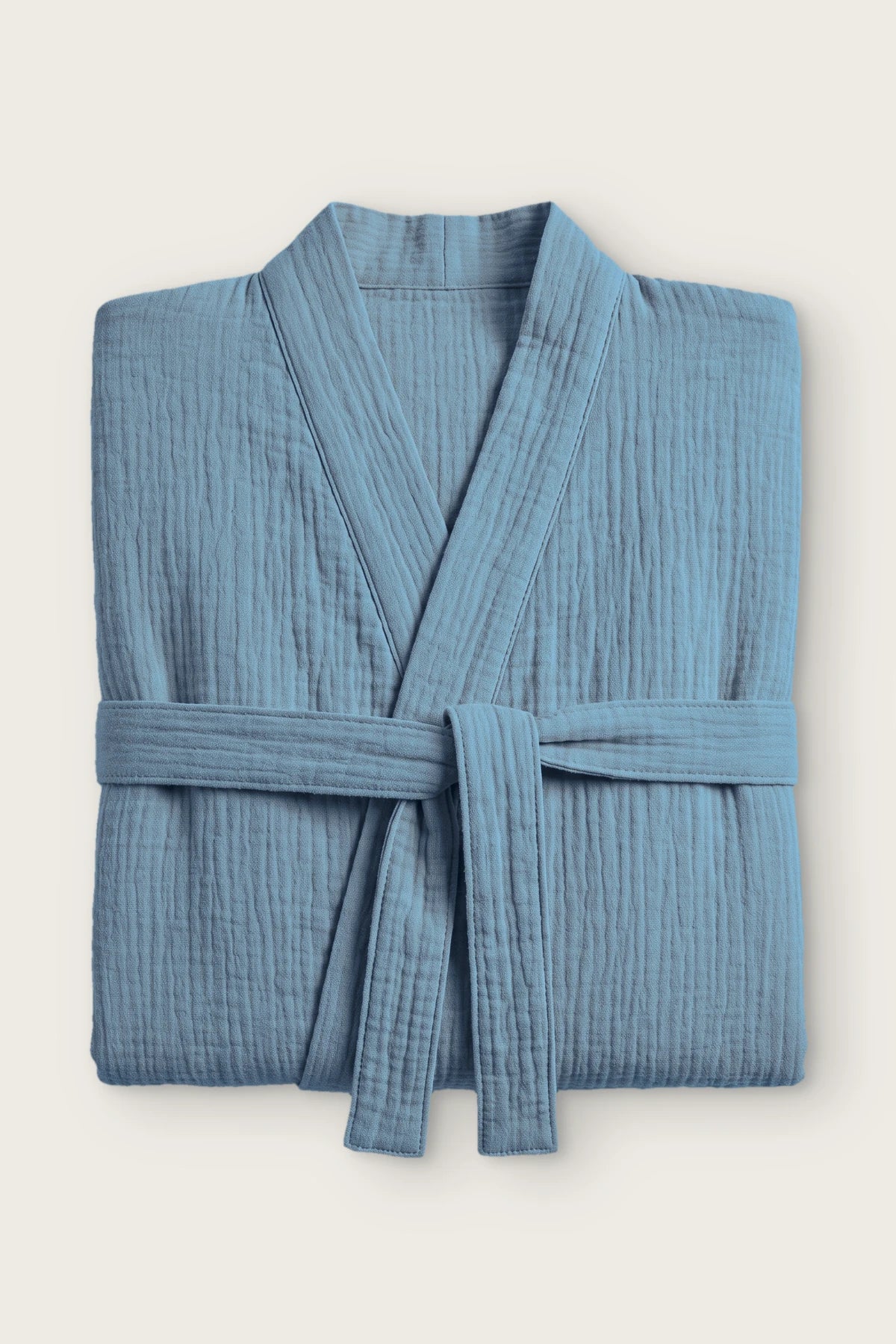 Handwoven 2-layer muslin kimono bathrobe in indigo blue, folded front view with tied belt