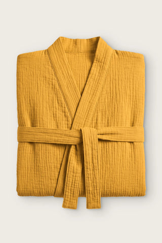 Handwoven 2-layer muslin kimono bathrobe in mustard, folded front view with tied belt