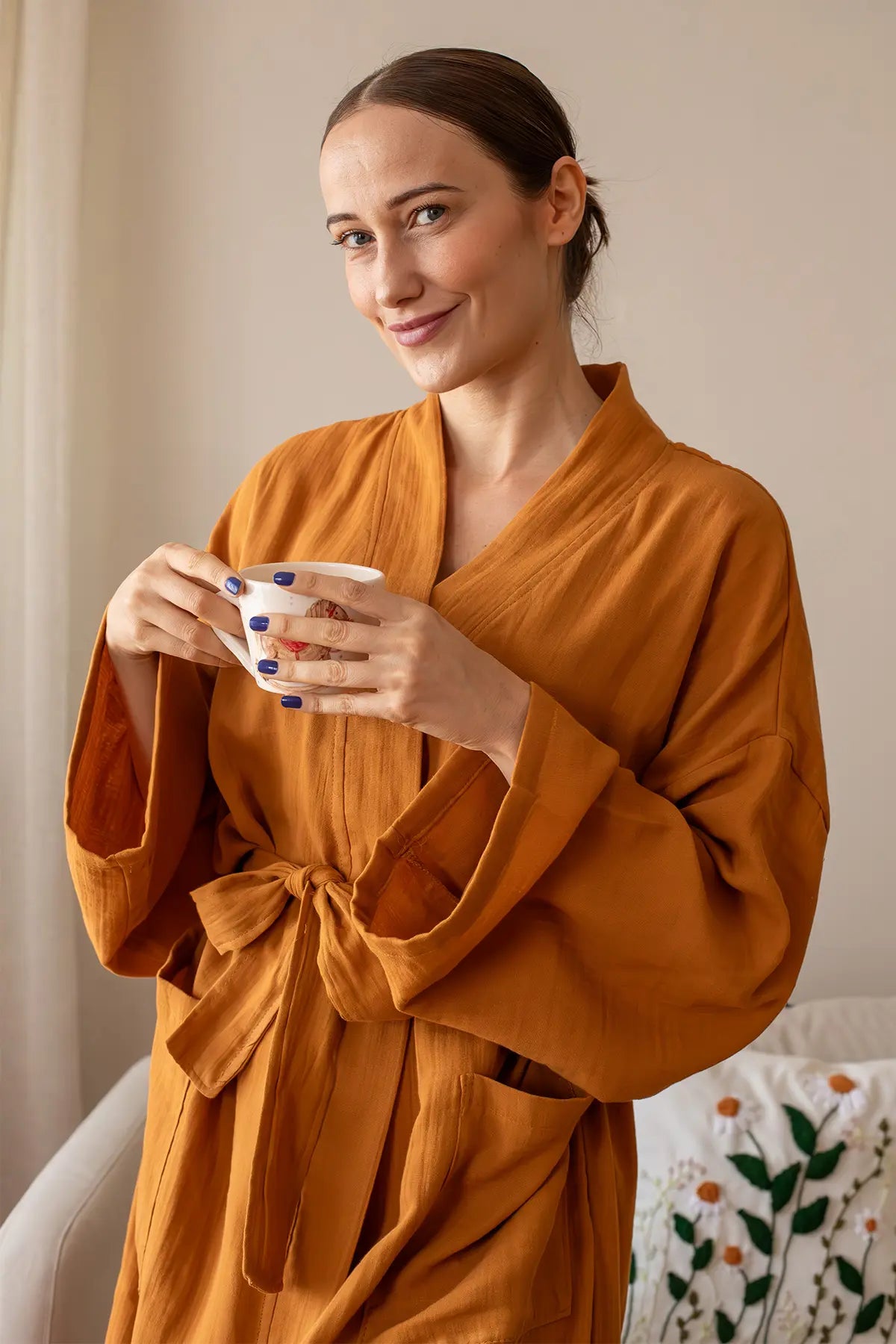 Orange 2-layer muslin bathrobe detail showing breathable gauze weave by Vivamaison