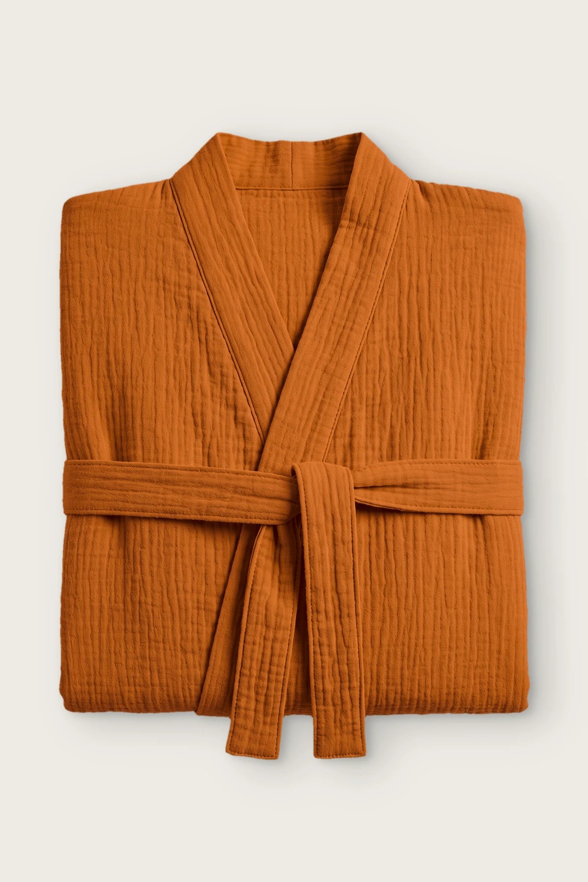 Handwoven 2-layer muslin kimono bathrobe in orange, folded front view with tied belt