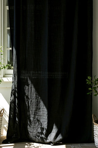 Black sheer panel by window, plant shadows. Handwoven 2-layer muslin cotton curtain, Denizli, OEKO-TEX. Vivamaison.