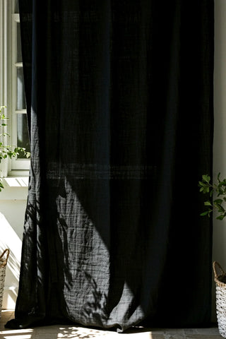Black sheer panel by window, plant shadows. Handwoven 2-layer muslin cotton curtain, Denizli, OEKO-TEX. Vivamaison.