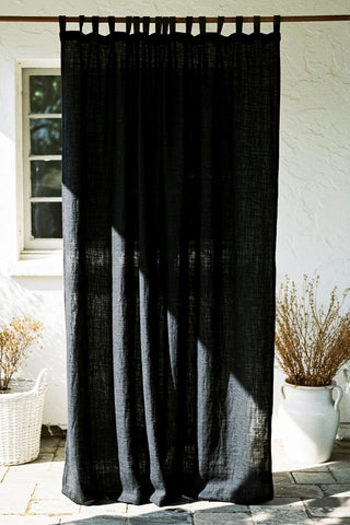 Full black tab top panel backlit outdoor wall. Handwoven 2-layer muslin cotton curtain, Denizli, OEKO-TEX. Vivamaison.