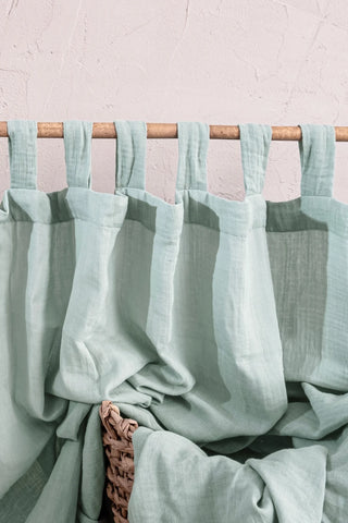 Mint tab loops close-up on bamboo rod. Handwoven 2-layer muslin cotton curtain, Denizli, OEKO-TEX. Vivamaison.