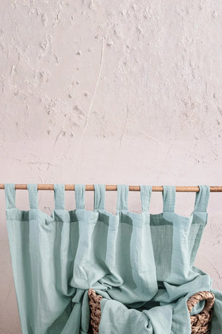 Mint tabs on rod with wicker basket. Handwoven 2-layer muslin cotton curtain, Denizli, OEKO-TEX. Vivamaison.