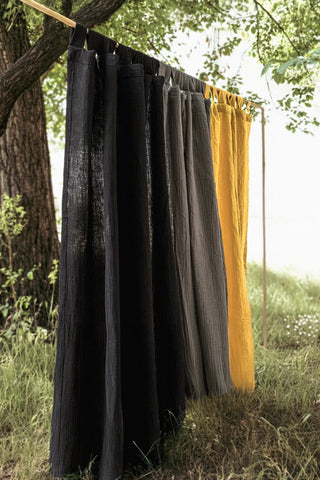 Black gray yellow panels on outdoor rod. Handwoven 2-layer muslin cotton curtain, Denizli, OEKO-TEX. Vivamaison.