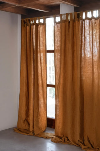 Camel tab top panels, wood beam interior. Handwoven 2-layer muslin cotton curtain, Denizli, OEKO-TEX. Vivamaison.