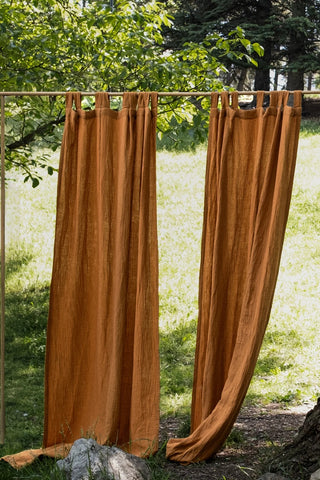 Cinnamon panels hanging in sunny garden. Handwoven 2-layer muslin cotton curtain, Denizli, OEKO-TEX. Vivamaison.