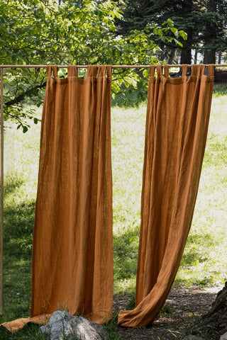 Cinnamon panels hanging in sunny garden. Handwoven 2-layer muslin cotton curtain, Denizli, OEKO-TEX. Vivamaison.