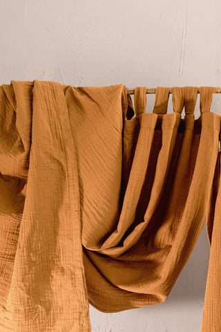 Camel tabs closeup with draped fabric swag. Handwoven 2-layer muslin cotton curtain, Denizli, OEKO-TEX. Vivamaison.
