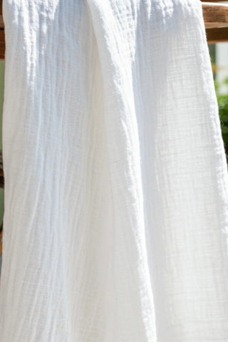 White crinkle muslin texture extreme closeup. Handwoven 2-layer muslin cotton curtain, Denizli, OEKO-TEX. Vivamaison.
