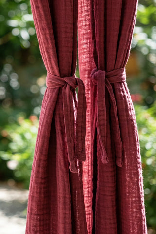 Curtain panels cinched with matching tieback knots. Handwoven 2-layer muslin cotton curtain, Denizli, OEKO-TEX. Vivamaison.