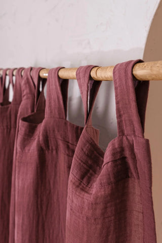 Close-up fabric tab loops on wooden rod. Handwoven 2-layer muslin cotton curtain, Denizli, OEKO-TEX. Vivamaison.