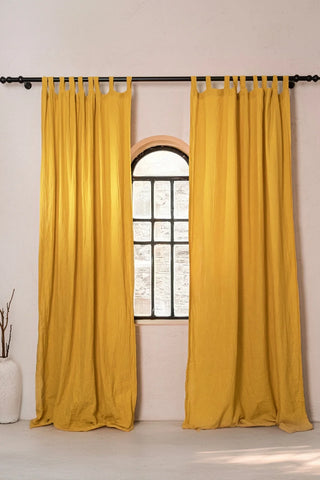 Mustard tab top pair, black rod, arched window. Handwoven 2-layer muslin cotton curtain, Denizli, OEKO-TEX. Vivamaison.