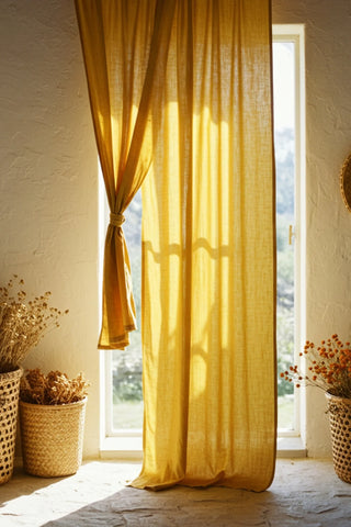 Mustard curtain with tieback at sunny window. Handwoven 2-layer muslin cotton curtain, Denizli, OEKO-TEX. Vivamaison.