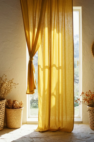 Mustard curtain with tieback at sunny window. Handwoven 2-layer muslin cotton curtain, Denizli, OEKO-TEX. Vivamaison.
