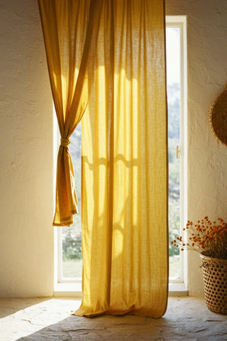 Mustard curtain tied back at tall window. Handwoven 2-layer muslin cotton curtain, Denizli, OEKO-TEX. Vivamaison.