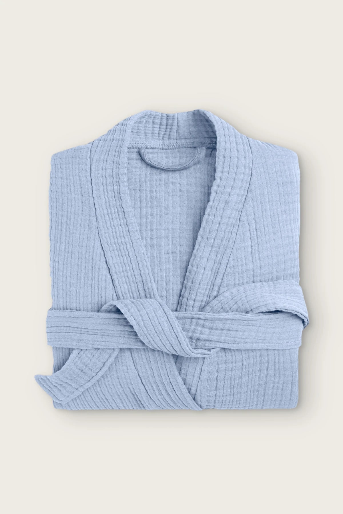 Handwoven 4-layer muslin kimono bathrobe in light blue, folded front view with wrapped belt