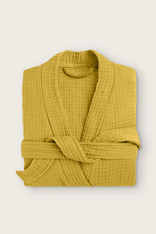 Handwoven 4-layer muslin kimono bathrobe in mustard, folded front view with wrapped belt