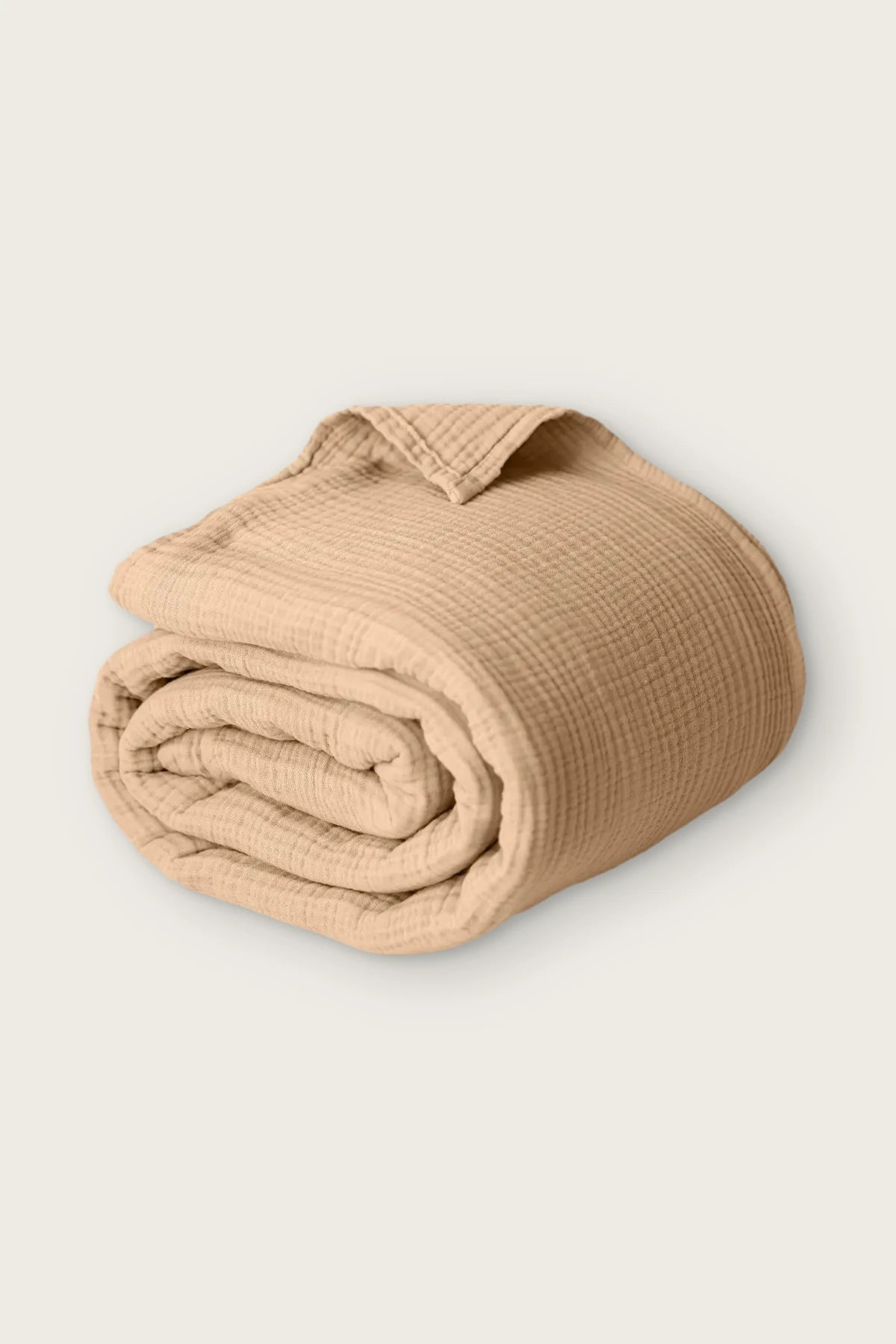 Handwoven 4-layer muslin cotton bedspread in brown, rolled front view