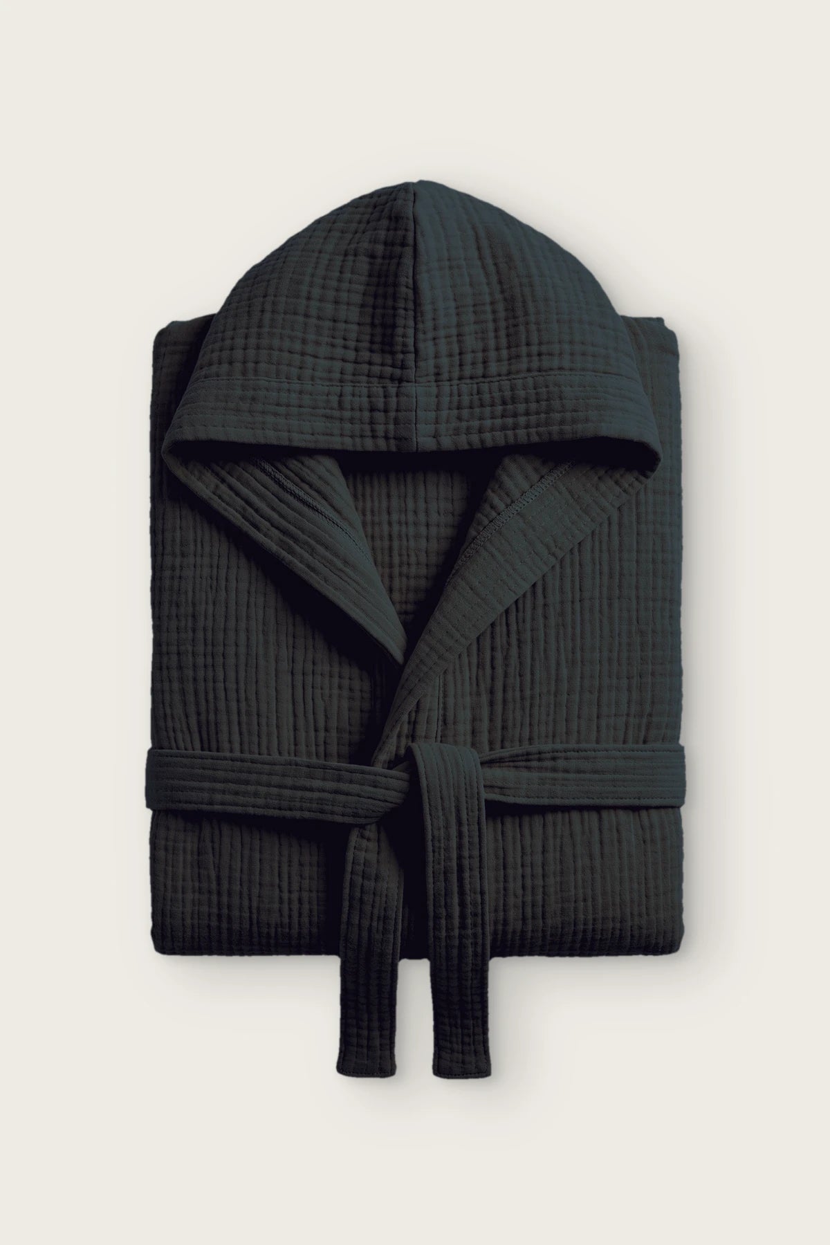 Handwoven 4-layer muslin hooded bathrobe in black, folded front view with hood and tied belt