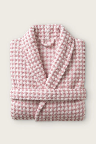 Handwoven bobble cotton hooded bathrobe in light pink, folded front view with shawl collar and belt
