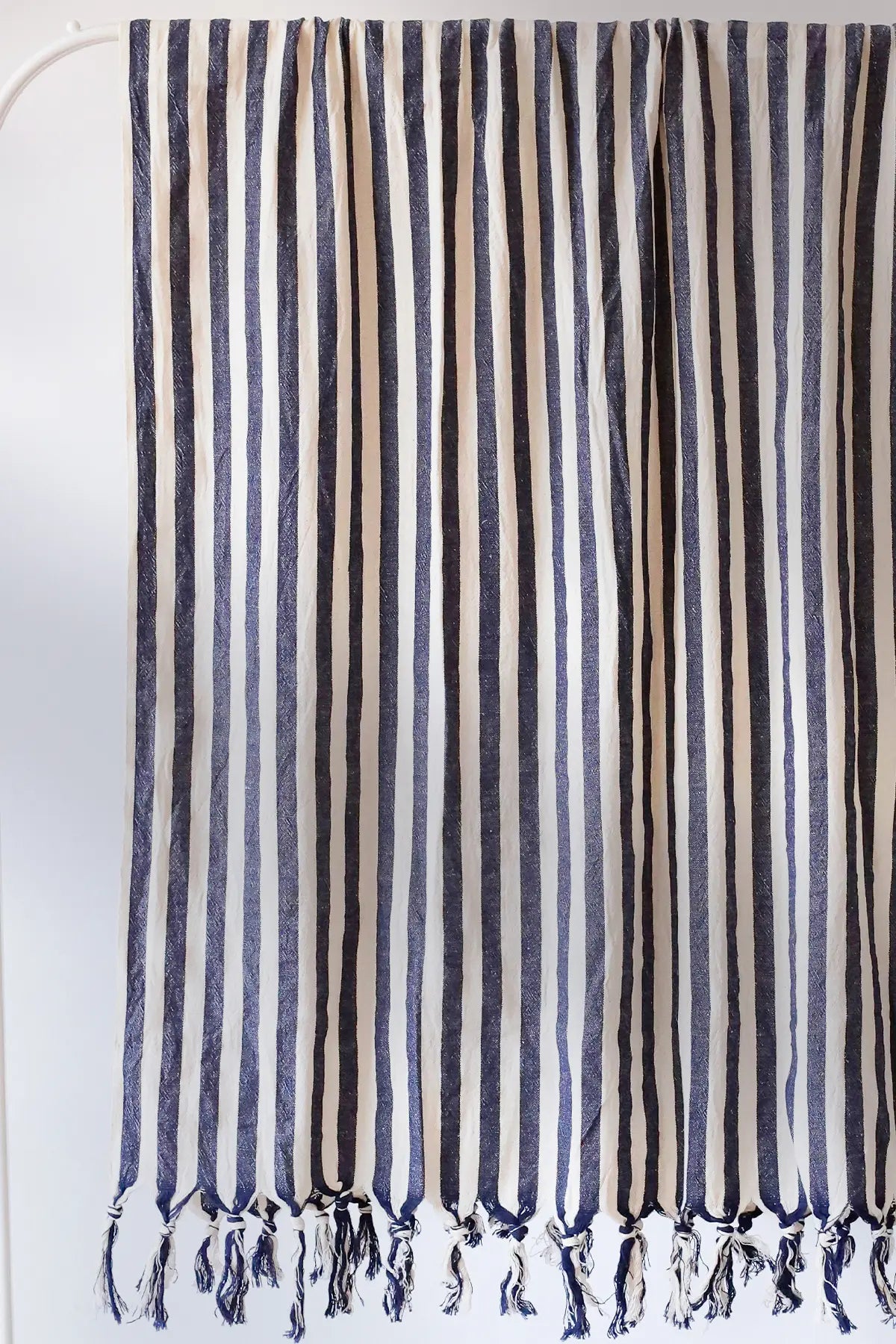 Navy blue classic striped peshtemal towel fringe detail closeup. Handwoven Turkish cotton Denizli, OEKO-TEX. Vivamaison.