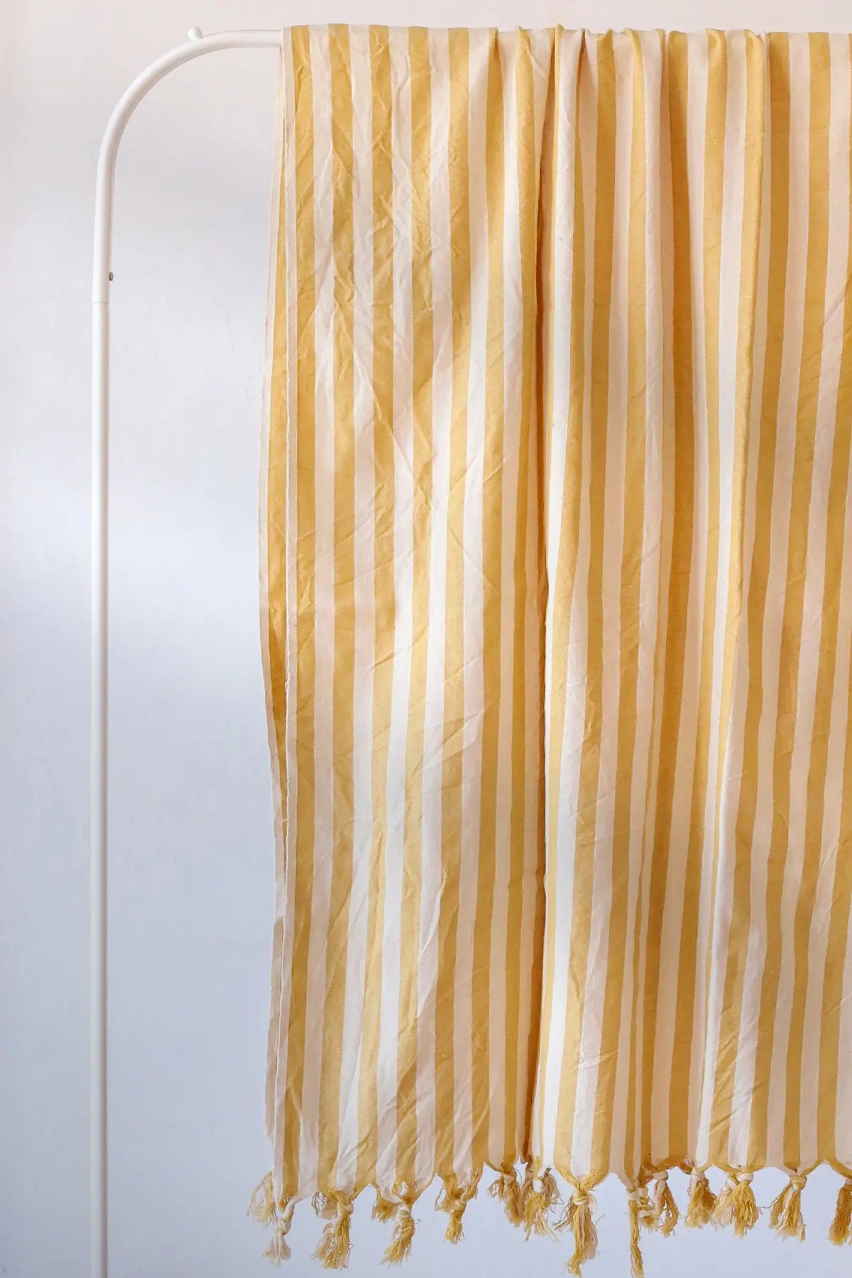 Yellow classic striped peshtemal towel fringe detail closeup. Handwoven Turkish cotton Denizli, OEKO-TEX. Vivamaison.