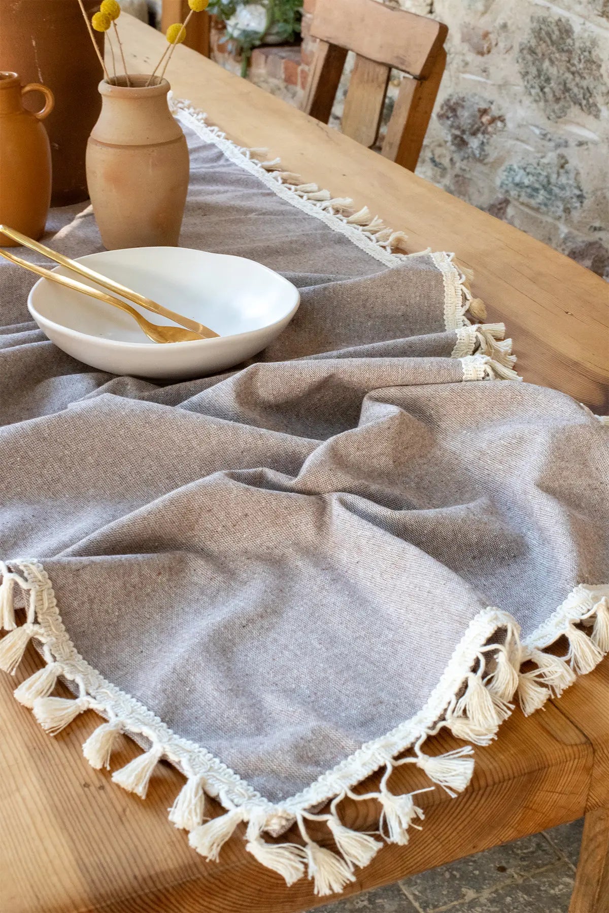 Brown handwoven Turkish cotton tassel table runner overhead. Hand-tied tassels Denizli, OEKO-TEX. Vivamaison.