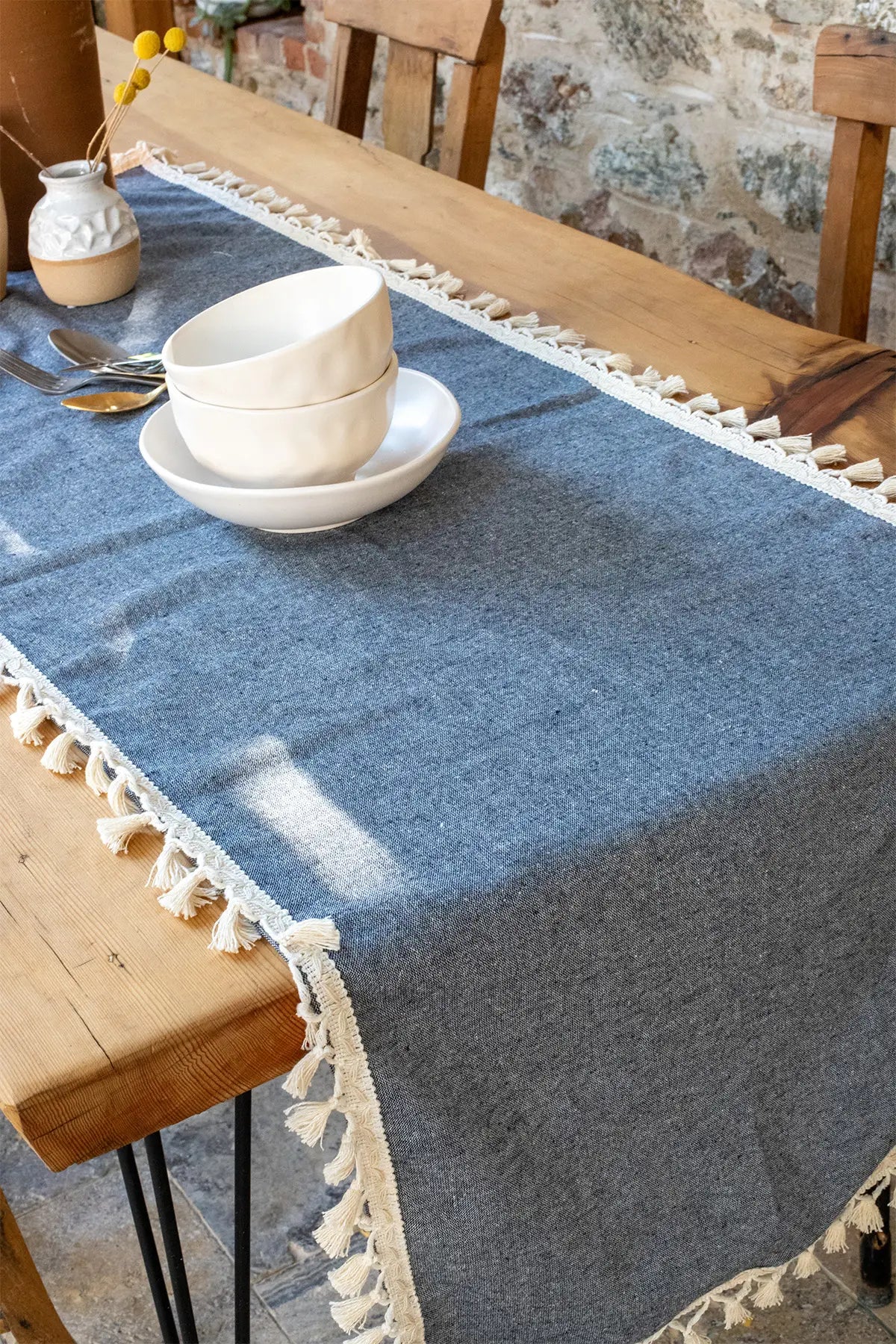 Navy Blue handwoven Turkish cotton tassel table runner folded flat lay. Hand-tied tassels Denizli, OEKO-TEX. Vivamaison.