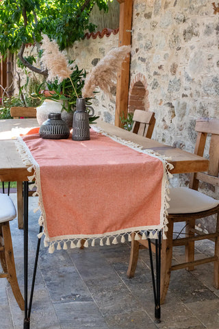 Orange handwoven Turkish cotton tassel table runner detail. Hand-tied tassels Denizli, OEKO-TEX. Vivamaison.