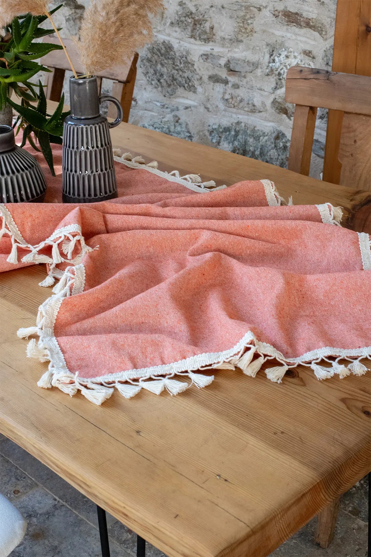 Orange handwoven Turkish cotton tassel table runner overhead. Hand-tied tassels Denizli, OEKO-TEX. Vivamaison.