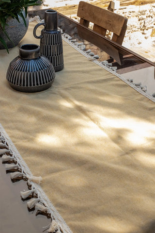 Yellow handwoven Turkish cotton tassel table runner overhead. Hand-tied tassels Denizli, OEKO-TEX. Vivamaison.