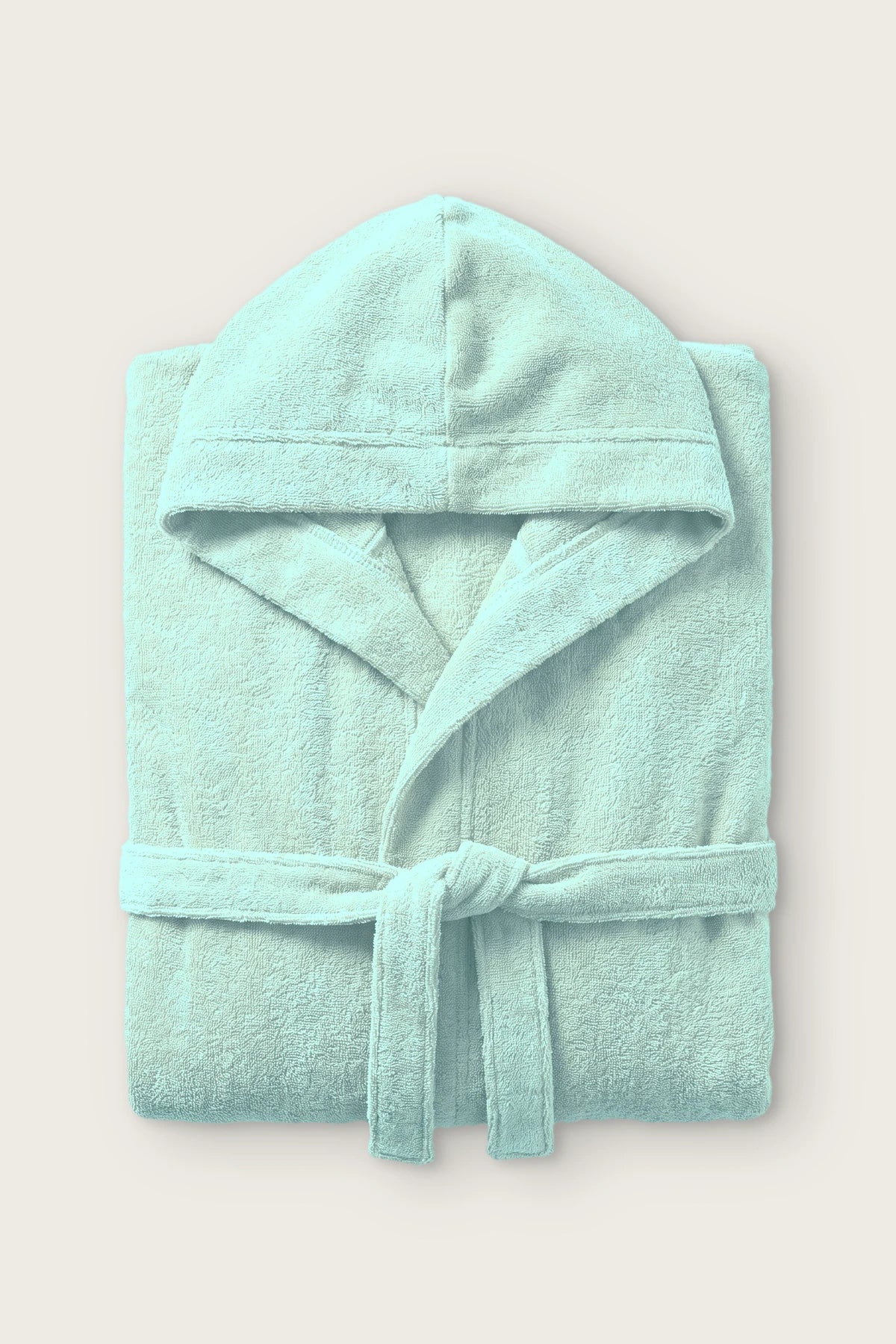 Handwoven Turkish cotton terry hooded bathrobe in mint, folded front view with hood and tied belt