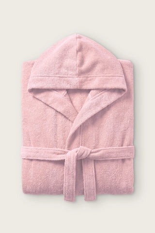 Handwoven Turkish cotton terry hooded bathrobe in pink, folded front view with hood and tied belt