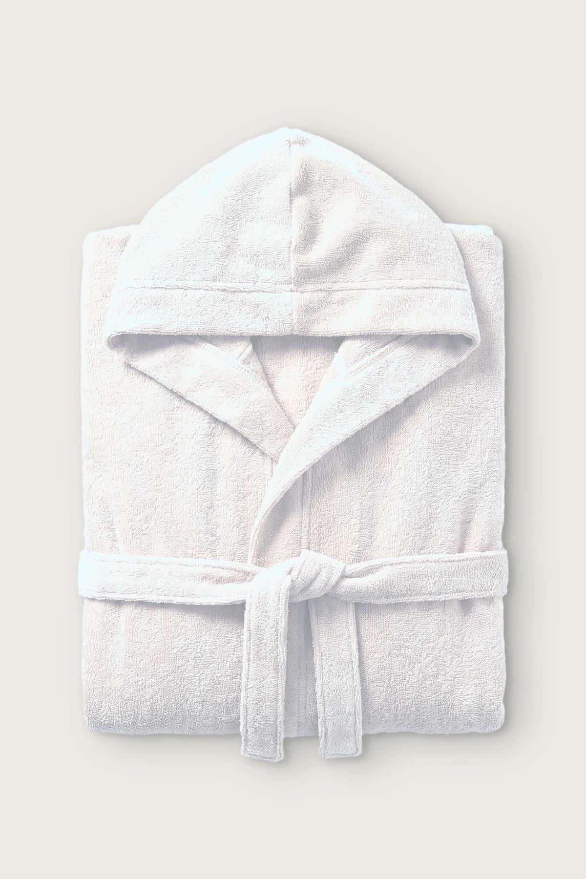Handwoven Turkish cotton terry hooded bathrobe in white, folded front view with hood and tied belt
