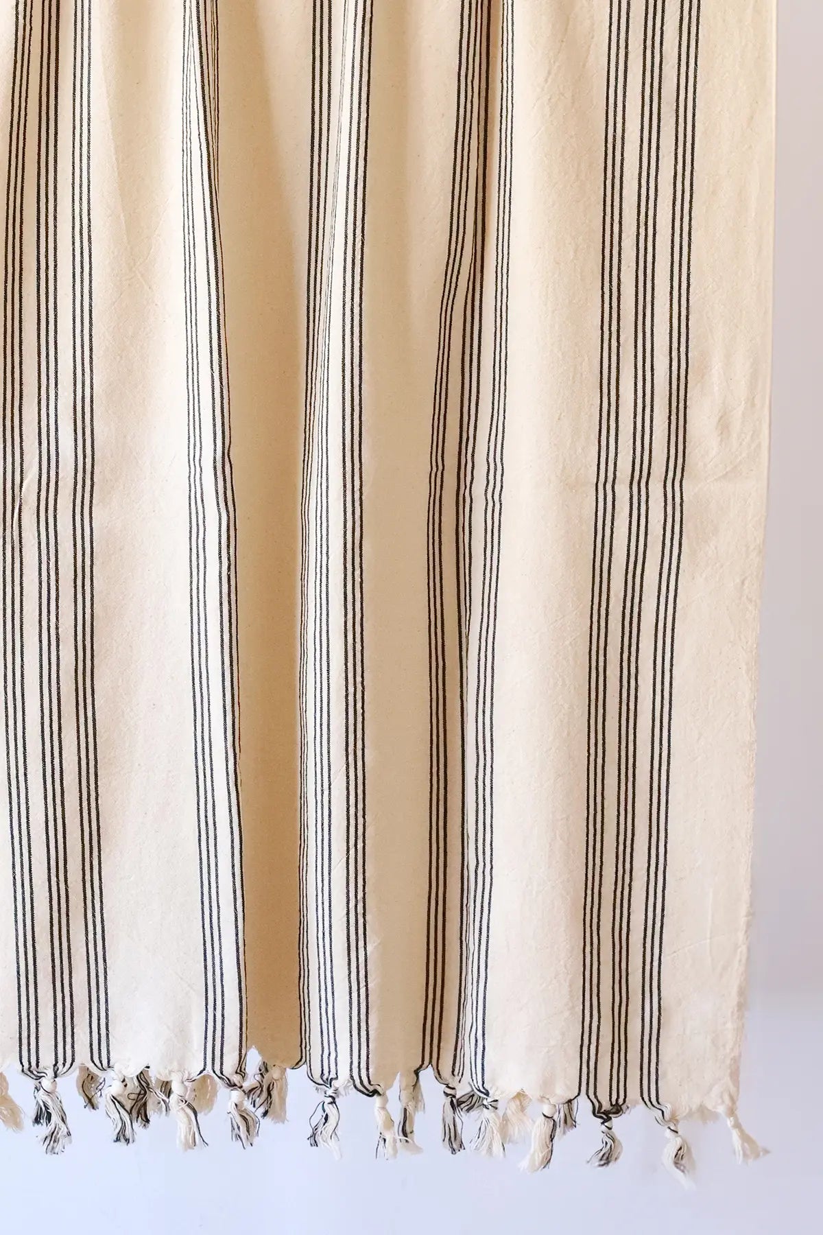 Black elegant striped peshtemal towel fringe detail closeup. Handwoven Turkish cotton Denizli, OEKO-TEX. Vivamaison.
