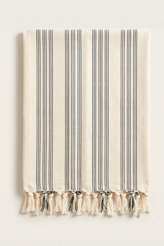 Elegant striped Turkish cotton peshtemal towel in black, folded front view with grouped stripes and knotted fringe