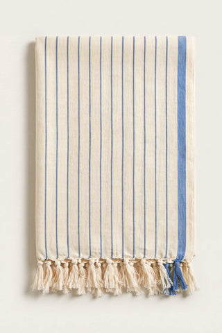 Luxury striped Turkish cotton peshtemal towel in blue, folded front view with side band and knotted fringe