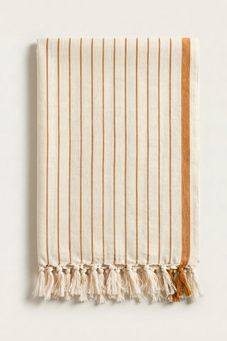 Luxury striped Turkish cotton peshtemal towel in brown, folded front view with side band and knotted fringe