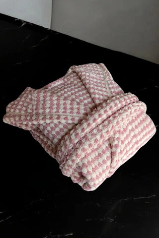 Light pink mosaic bathrobe folded flat lay. Handwoven Turkish cotton Denizli, OEKO-TEX. Vivamaison.
