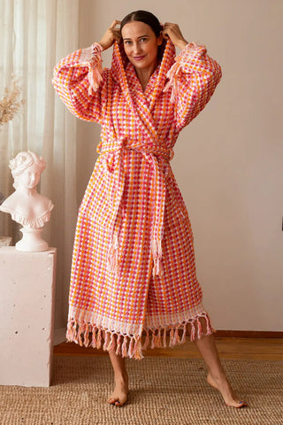 Handwoven mosaic weave bathrobe in pink orange, hood up front. Turkish cotton Denizli, OEKO-TEX. Vivamaison.