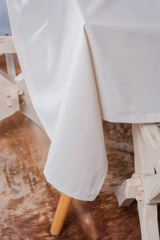 Natural handwoven raw linen plain tablecloth folded drape. Undyed flax Denizli, OEKO-TEX. Vivamaison.