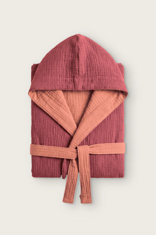 Reversible 4-layer muslin hooded bathrobe, burgundy outer and terracotta inner, folded front view